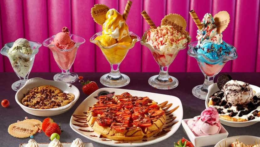 Kaspa's Desserts signature menu showcase with five colourful ice cream sundaes topped with fresh fruit, waffles with chocolate sauce, brownies and ice cream against a pink branded backdrop